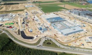Commercial construction site with new buildings, roads, and property improvements, relevant to deciding when to get an ALTA survey as site conditions change